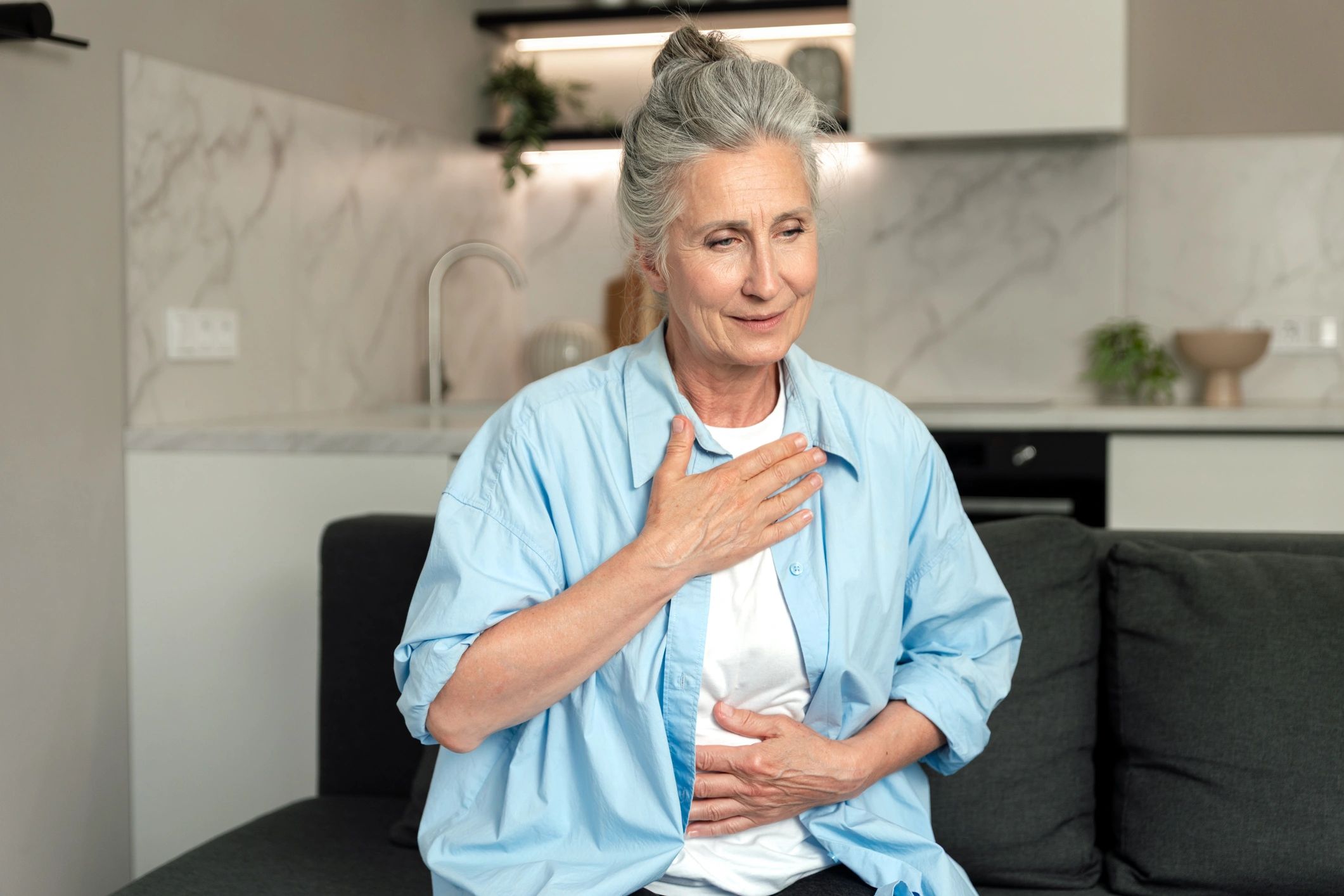 Woman practicing calm breathing at home